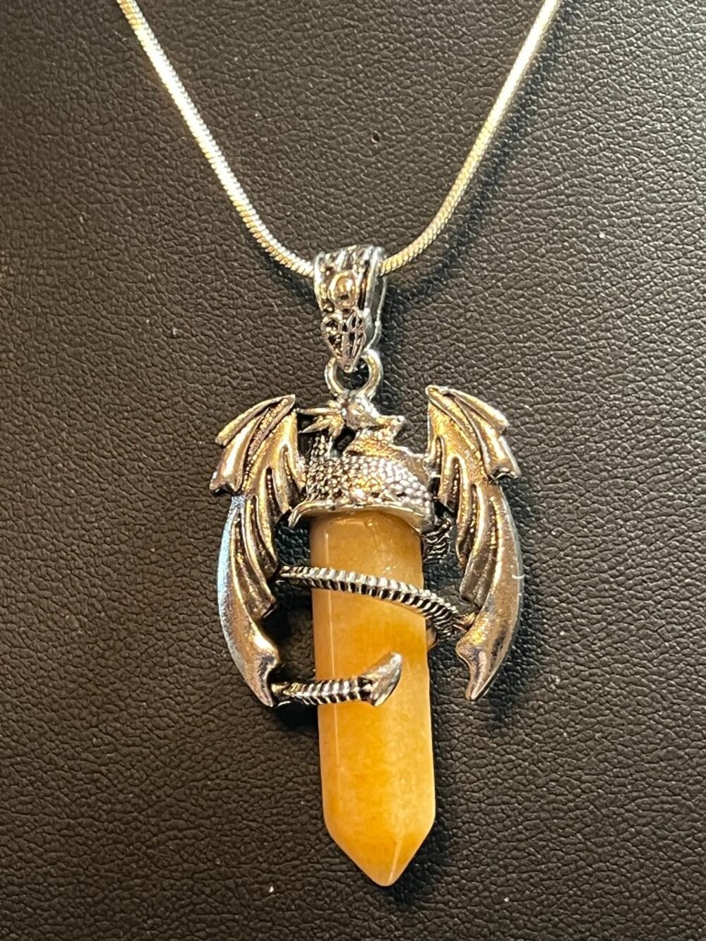 Pale Brown Simulated Crystal Encased by a Silvertone Dragon (330)